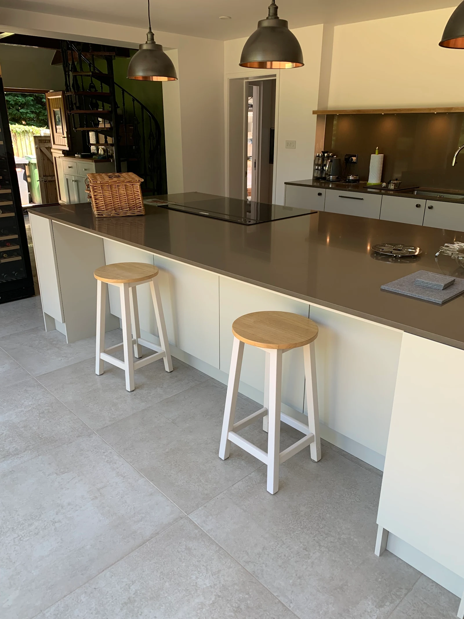 Walnut and grey handleless kitchen with a large island and breakfast bar