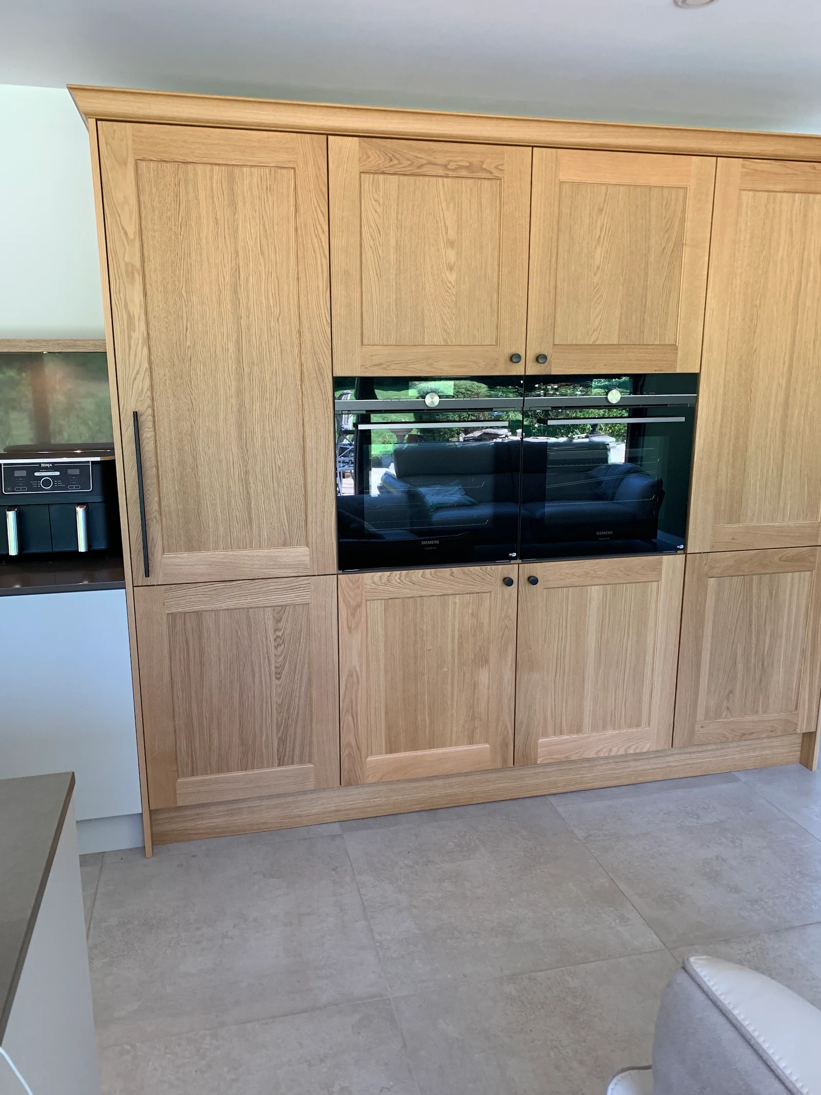Bespoke solid oak larder and tall units with built-in ovens
